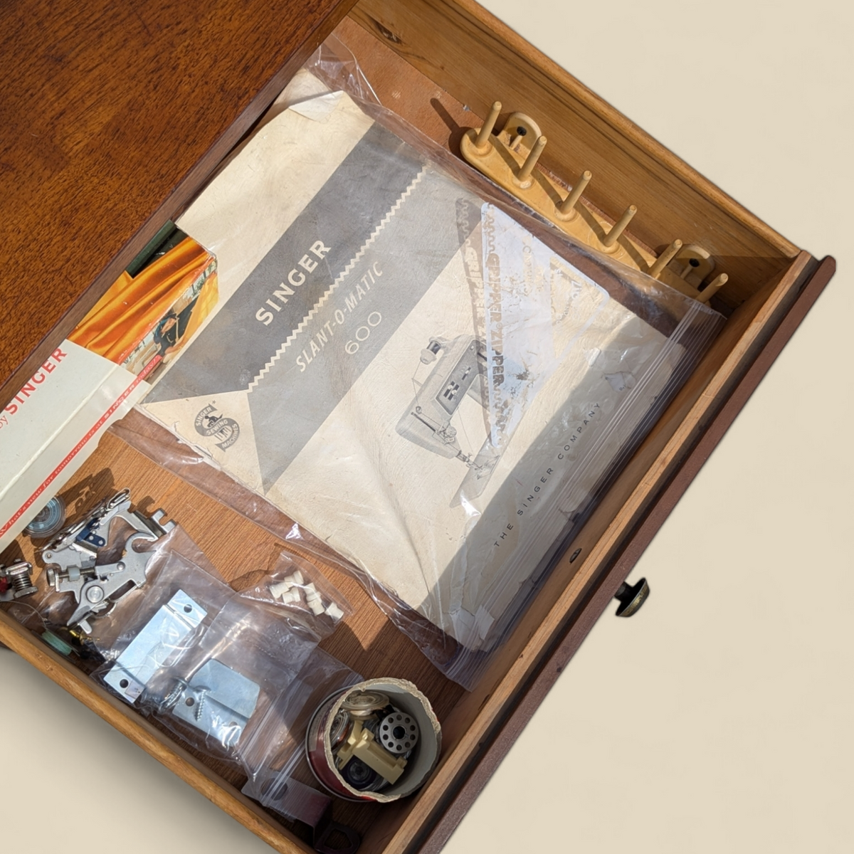 1966 Singer Slant-O-Matic 600 Sewing Machine in Mid-Century Wood Cabinet — view 16 of 18