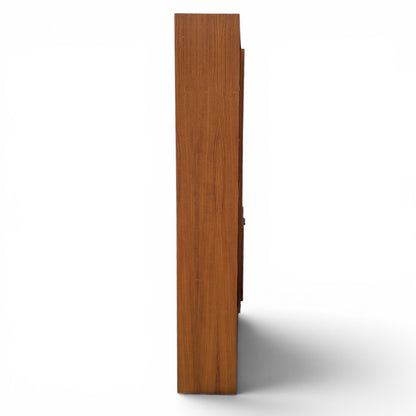 A trio of teak bookcases