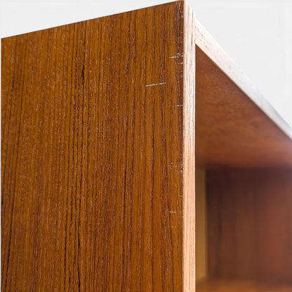 A trio of teak bookcases