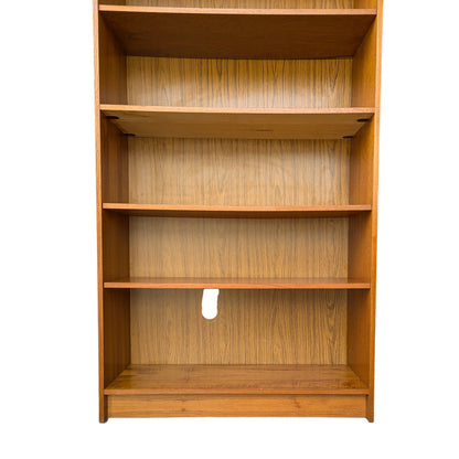 A trio of teak bookcases