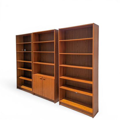 A trio of teak bookcases