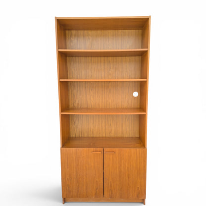 A trio of teak bookcases