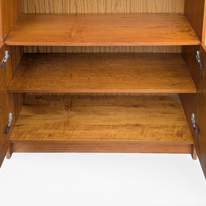 A trio of teak bookcases