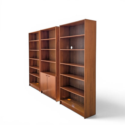 A trio of teak bookcases