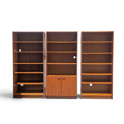 A trio of teak bookcases